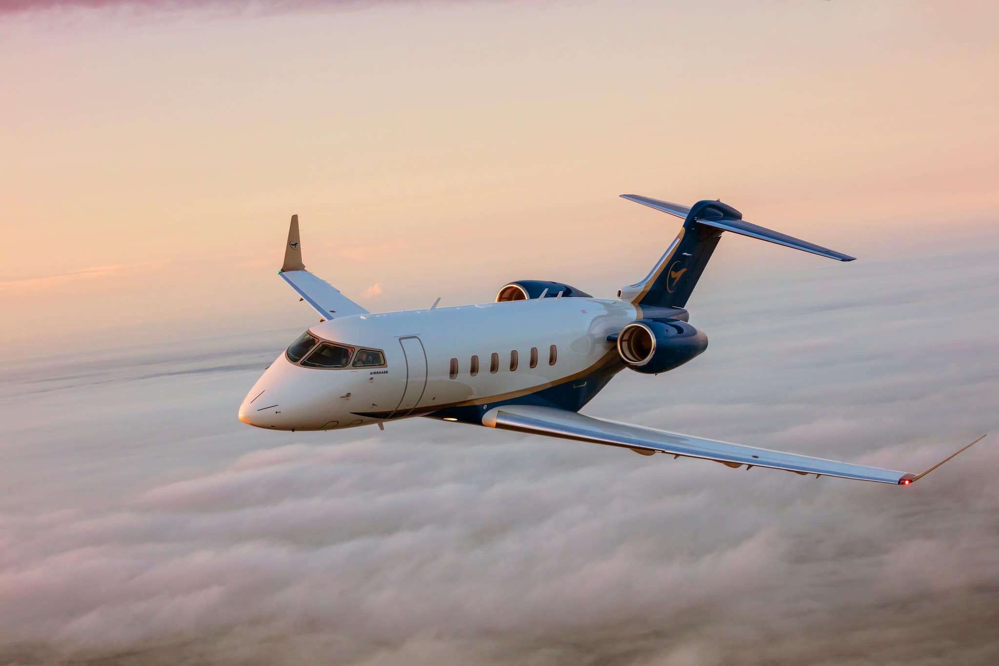 Private jets on tarmac at sunset